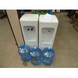 2 water dispensers a 3 bottles of water