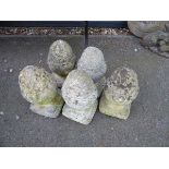 Five concrete acorn finials