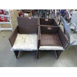 Four brown rattan garden chairs