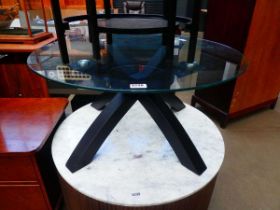 Circular glass topped occasional table on black x base