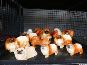 Cage containing ceramic dog figures