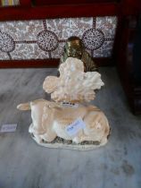 Reproduction Staffordshire cow together with a bronzed Buddha