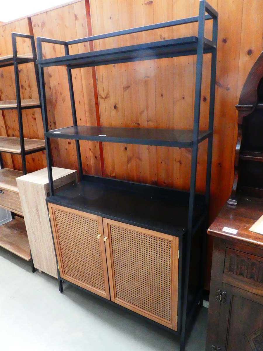 Black shelving unit with bergere style doors