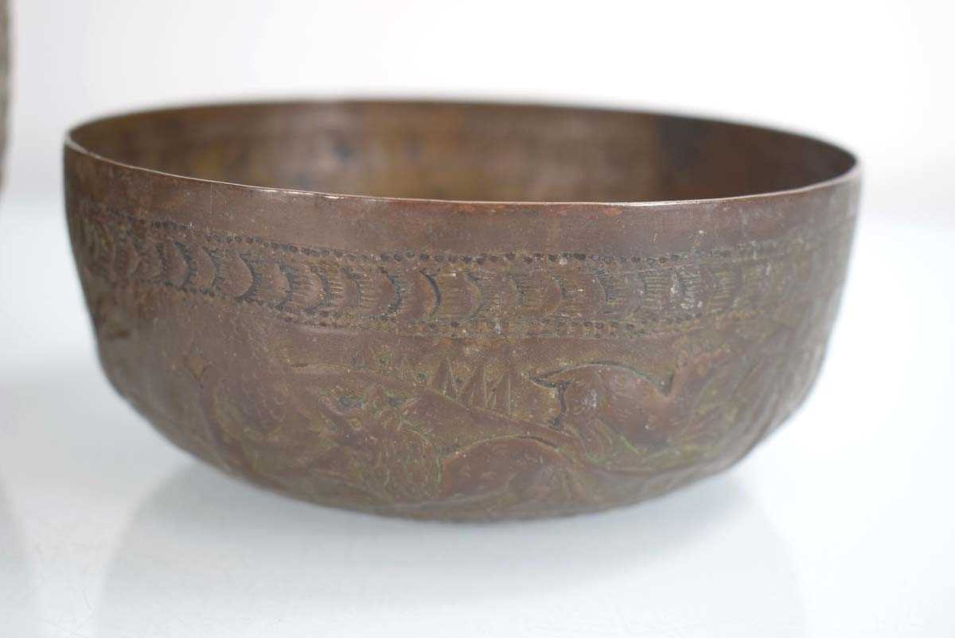 A South East Asian brass bowl relief decorated with figures in a garden landscape, di. 15.5 cm, h. - Image 2 of 4