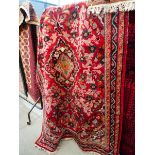 (14) Iranian carpet with red and salmon ground