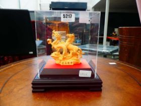 Oriental figure under perspex case