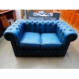 Blue leather effect two seater Chesterfield sofa
