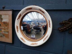 Circular convex mirror with cream and gilt painted frame