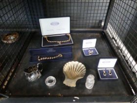 Cage containing costume jewellery, silver plated ware, and silver topped bottle