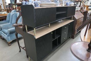 Low entertainment unit with oak effect top and black ridged doors