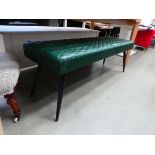 Green padded seat on spindle legs