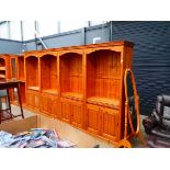 Pine 4-section cabinet with open bookcases over closed doors Width: 380cmHeight: 206cmDepth: 46cm