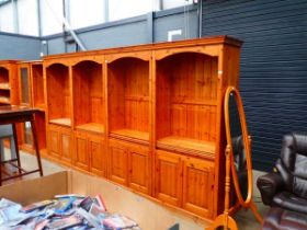 Pine 4-section cabinet with open bookcases over closed doors Width: 380cmHeight: 206cmDepth: 46cm