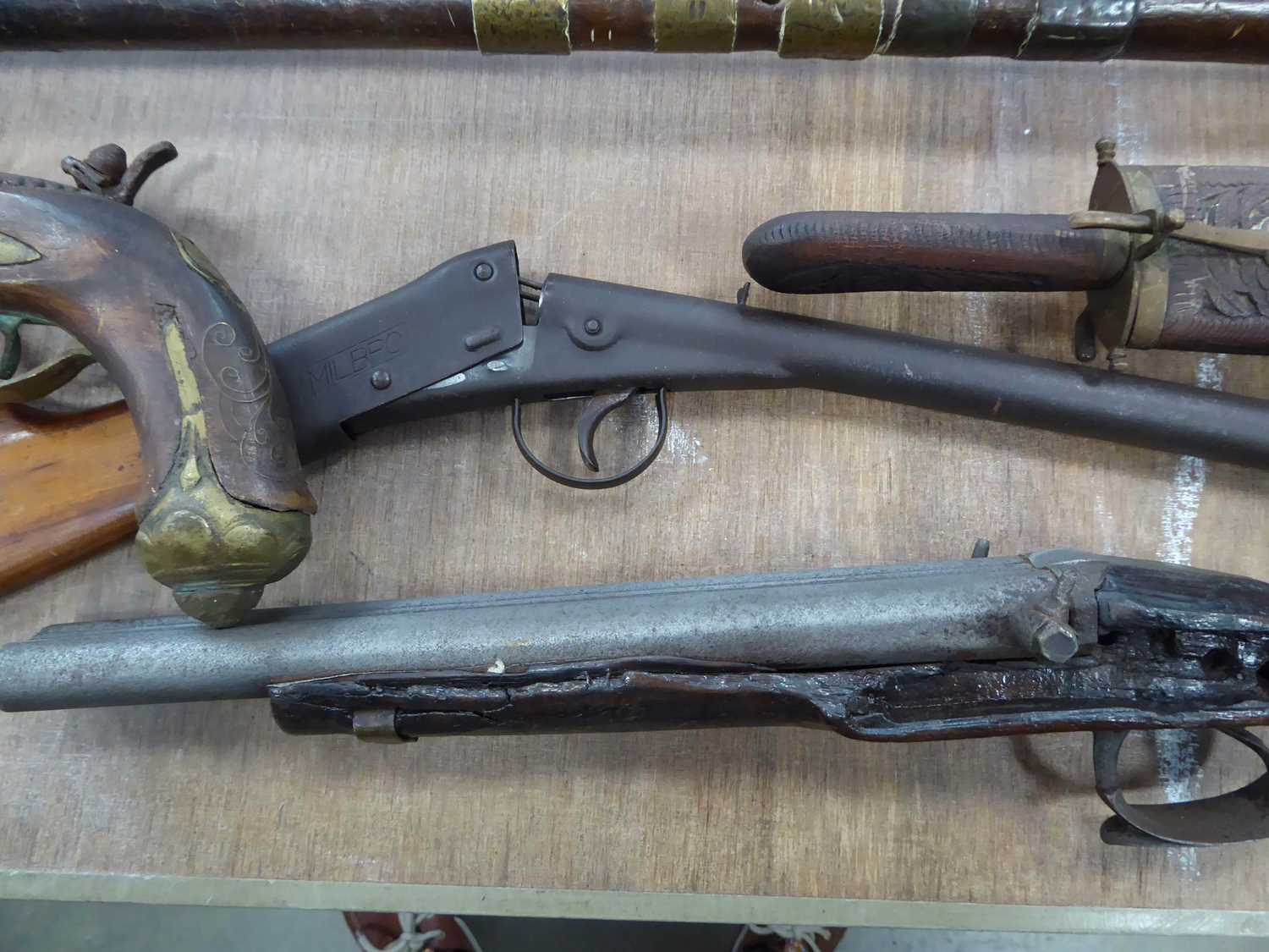 Milbro tinplate air rifle, coach gun (missing lock), pistol and three various Eastern knives - Image 2 of 6