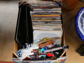 Box of vinyl LP's together with miniature guitars etc