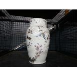 A Japanese vase of shouldered form, decorated in coloured enamels with a butterfly amongst flowers