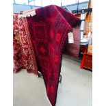 (16) All wool carpet with red ground and repeated motifs