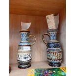 Two Doulton stoneware mugs One has extensive damage to handle but has been repaired.Height: 21cm