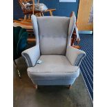 Contemporary grey button upholstered armchair