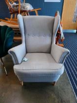 Contemporary grey button upholstered armchair