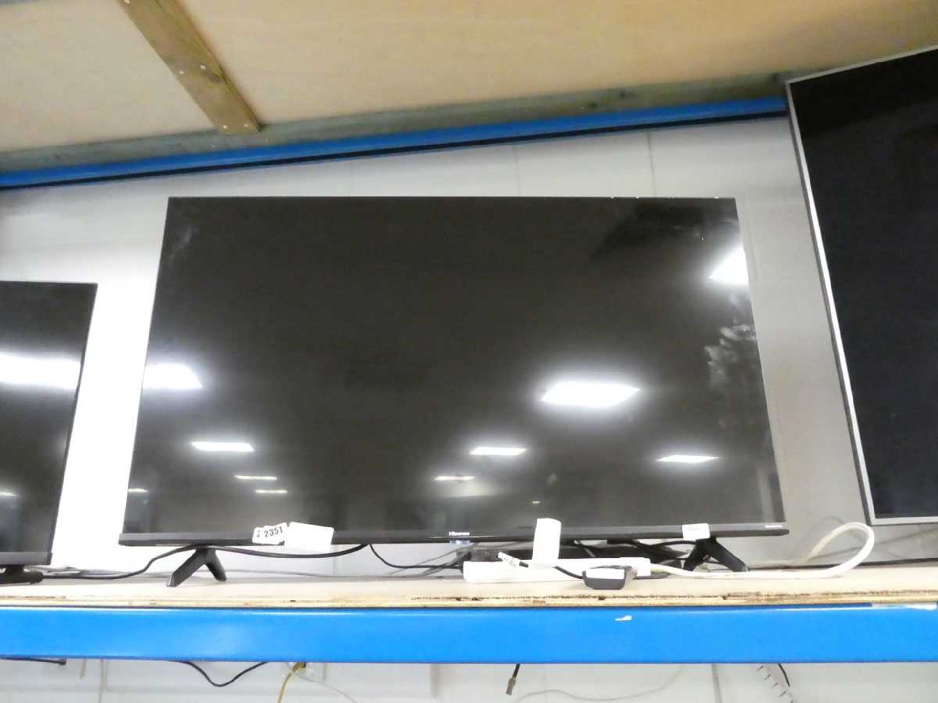 +VAT 43" Hisense TV model 43E7KQTUK with remote control (R59) and stand