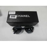 Pair of Chanel sunglasses in case