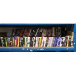 Half shelf of fiction books