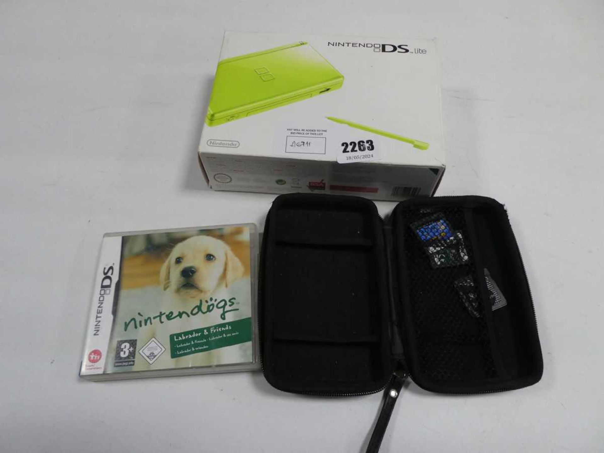 +VAT Nintendo DS Lite along with Nintendogs game and case containing unboxed Nintendo DS games