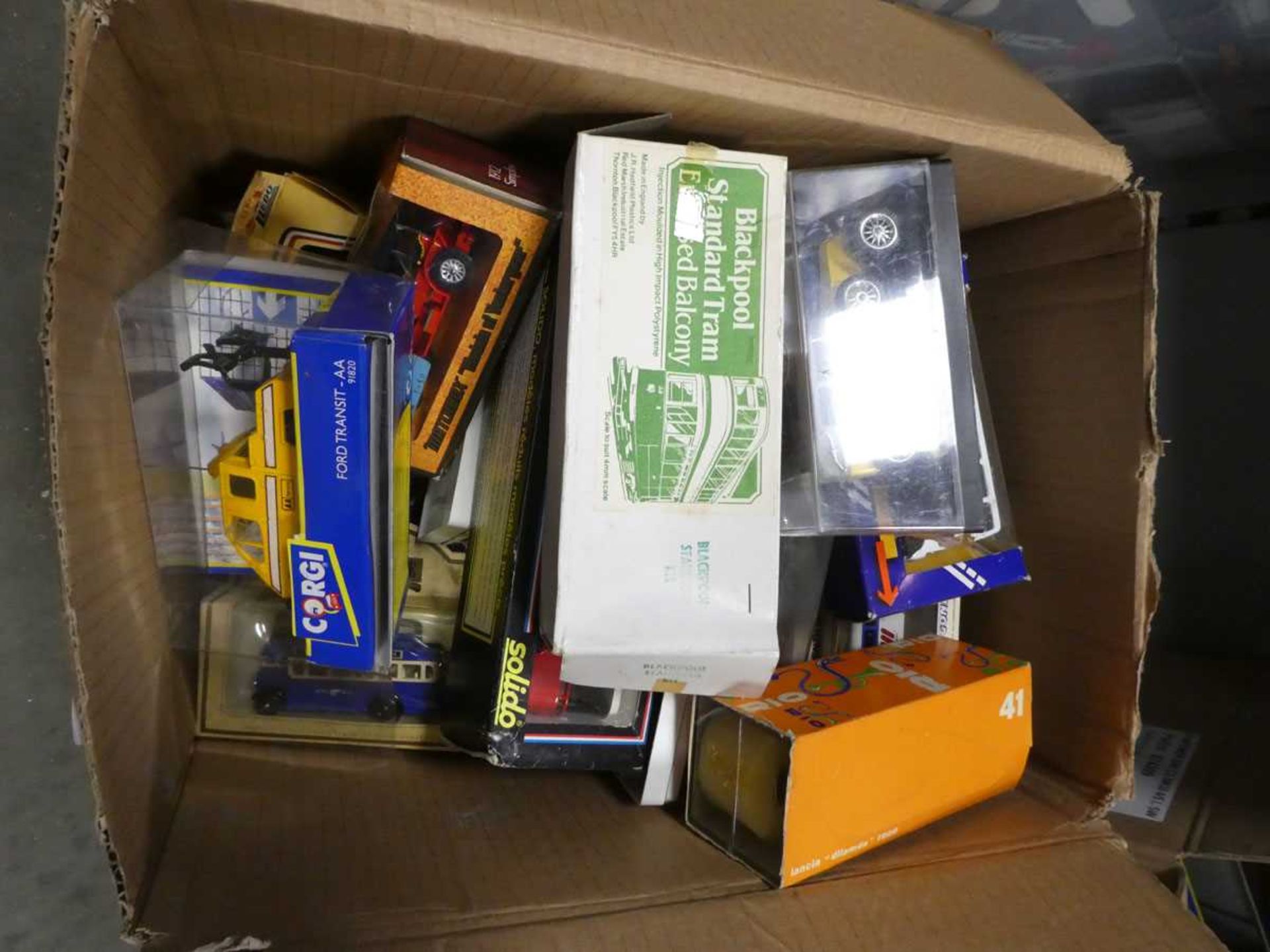 Box containing diecast vehicles