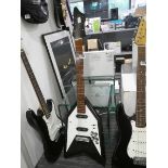 Arrow-shaped electric guitar in black and white