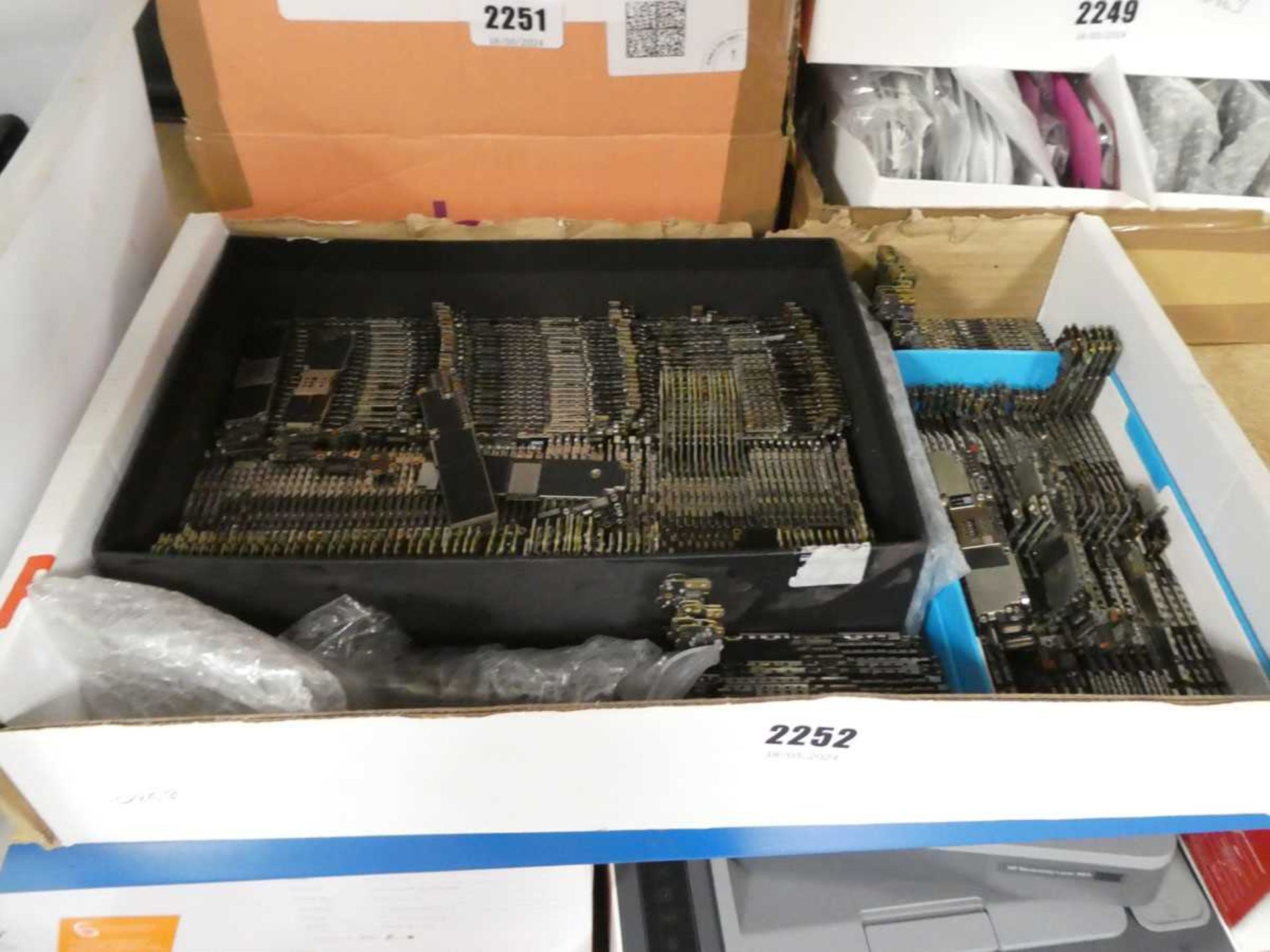 Box containing mobile phone motherboards