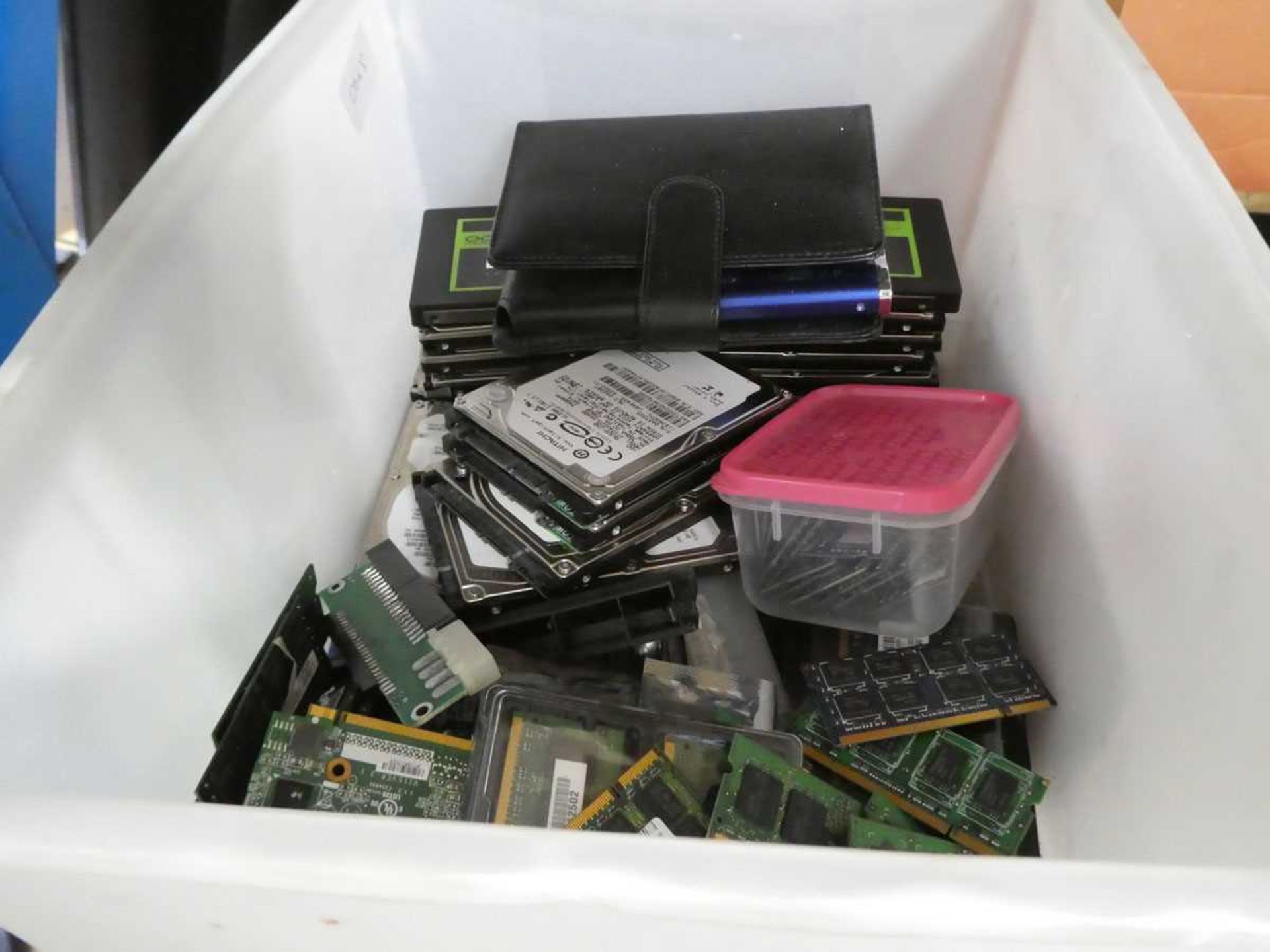 Box containing various components for PCs and laptops, hard drives, motherboards, etc