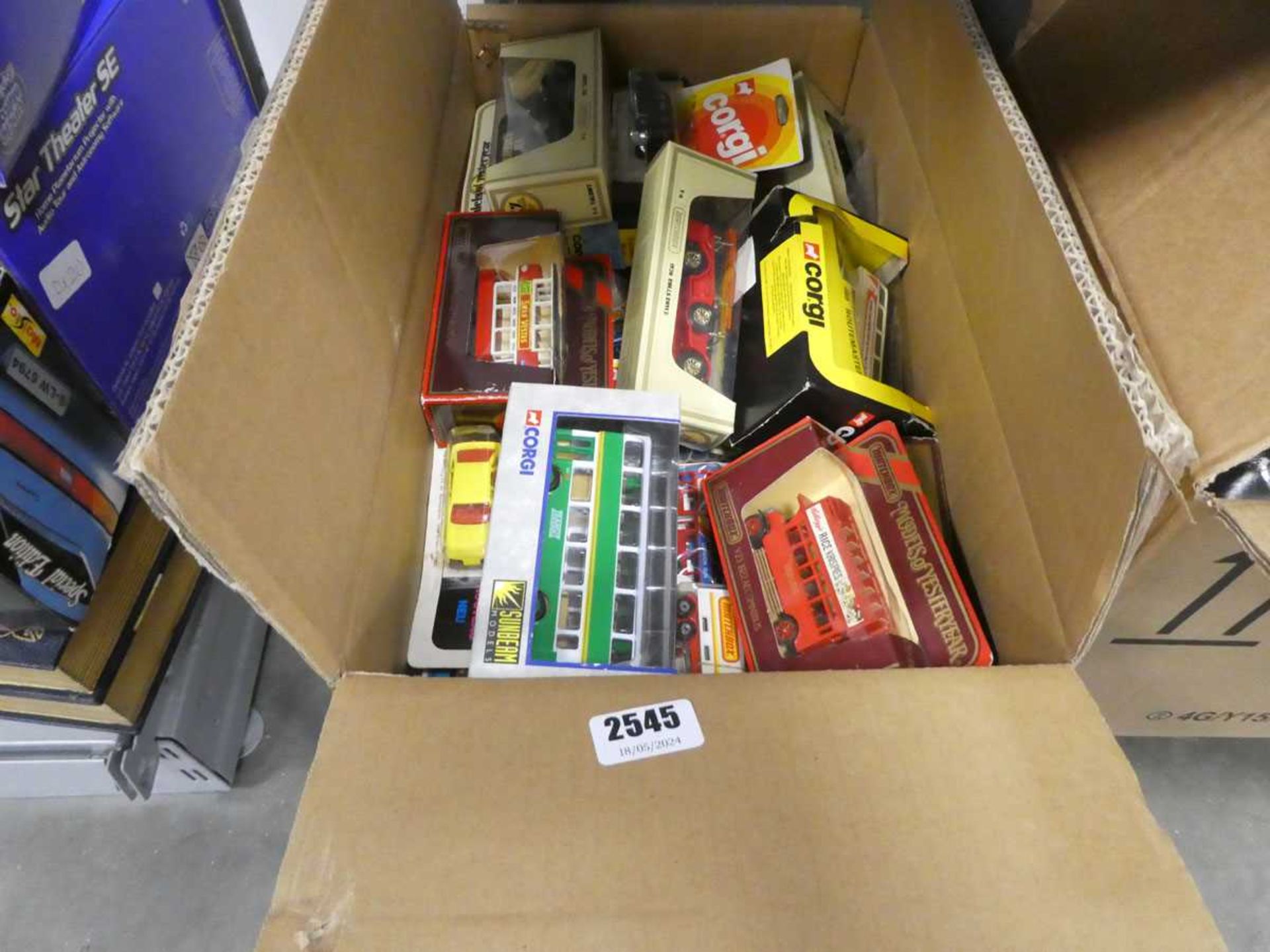 Box containing various Corgi and other die cast cars