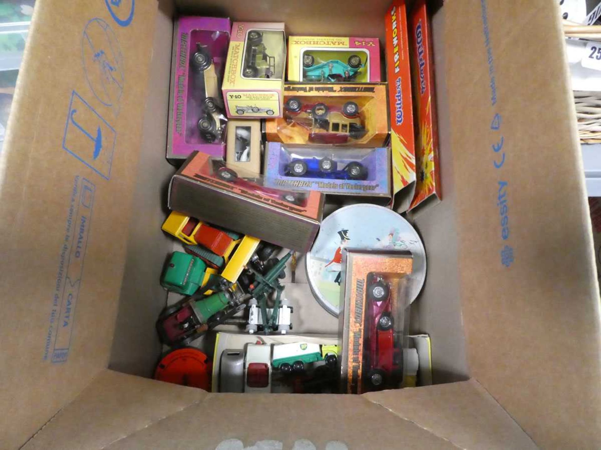 Box containing various diecast cars