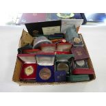 Box containing various commemorative coins