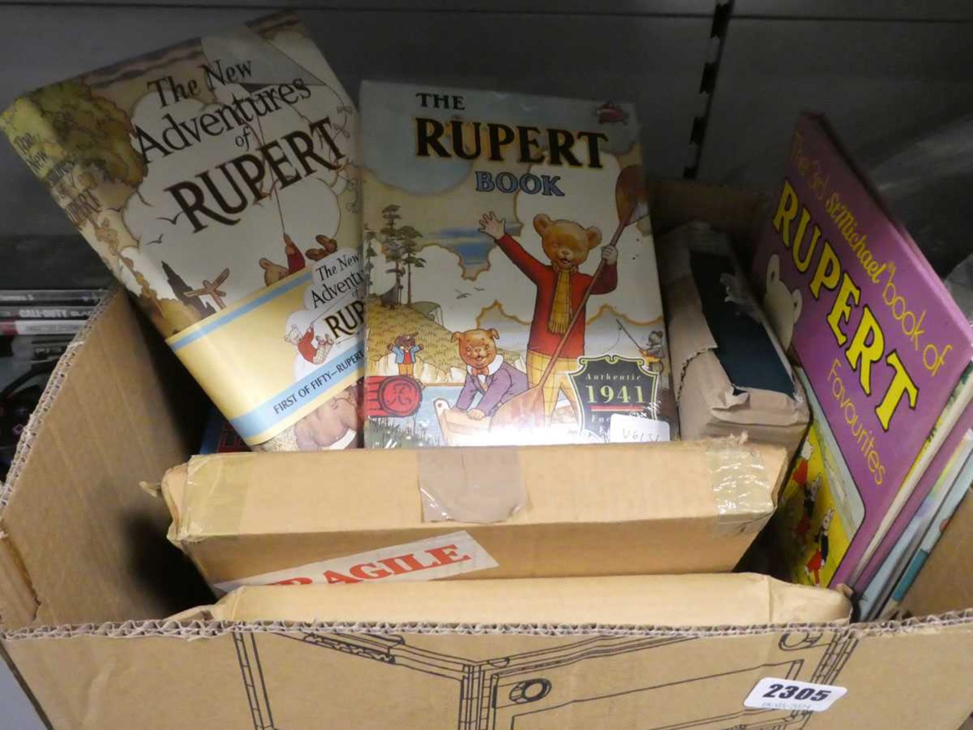 Box containing various kids annuals inc. Rupert books