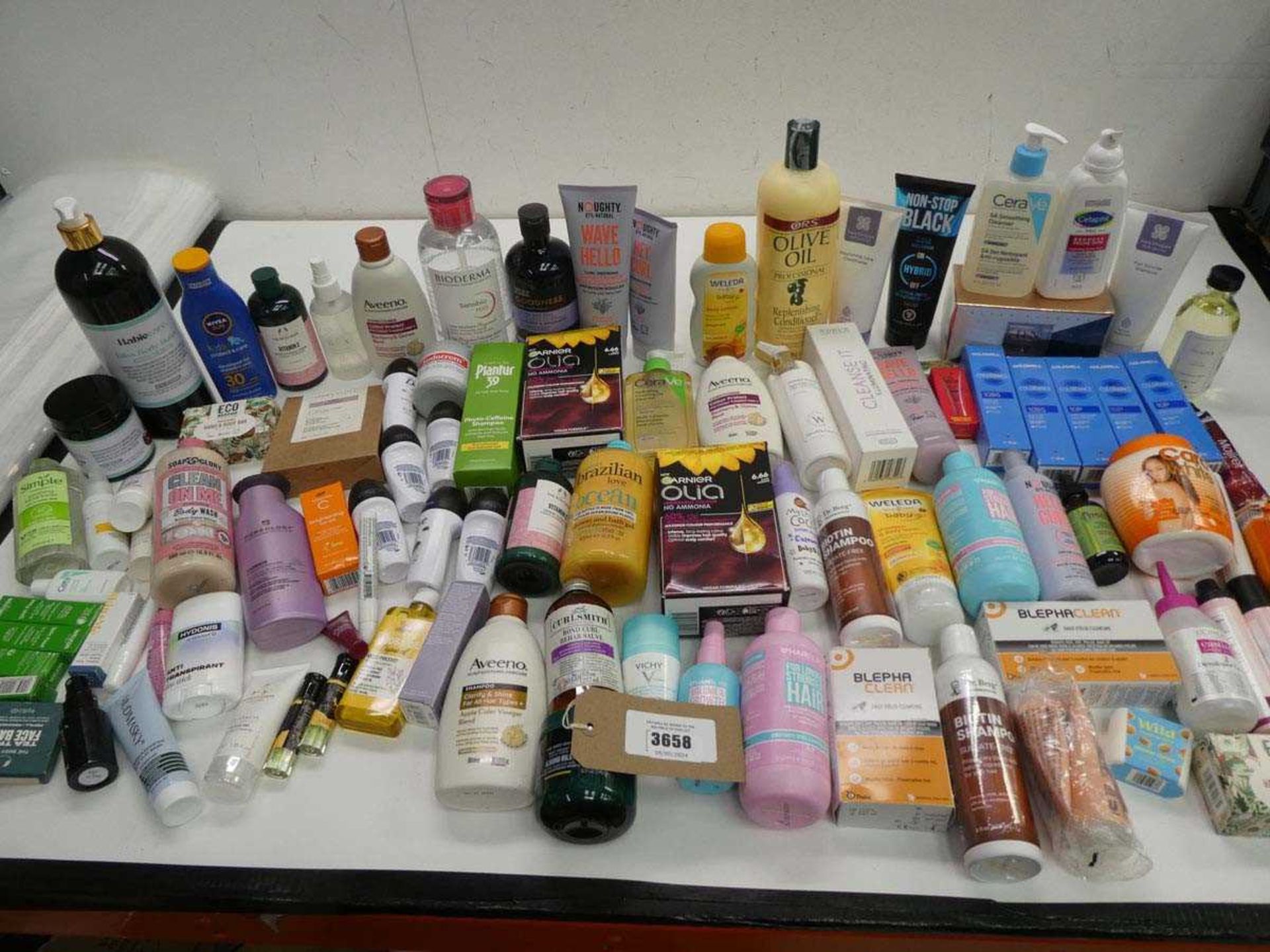 +VAT Large bag of toiletries including sun protection, cleanser, body wash, hair products etc