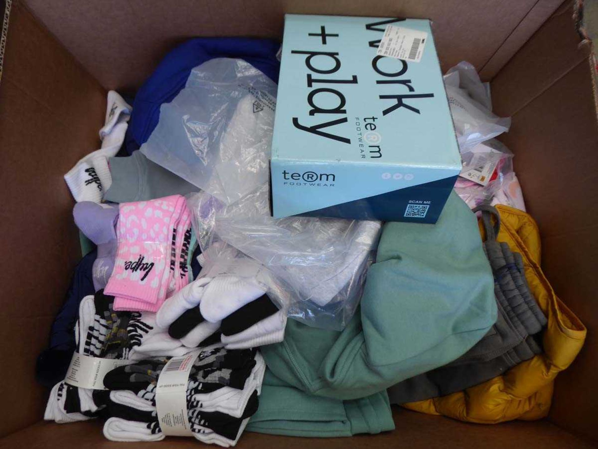 Large box containing mixed children's clothing, in various sizes