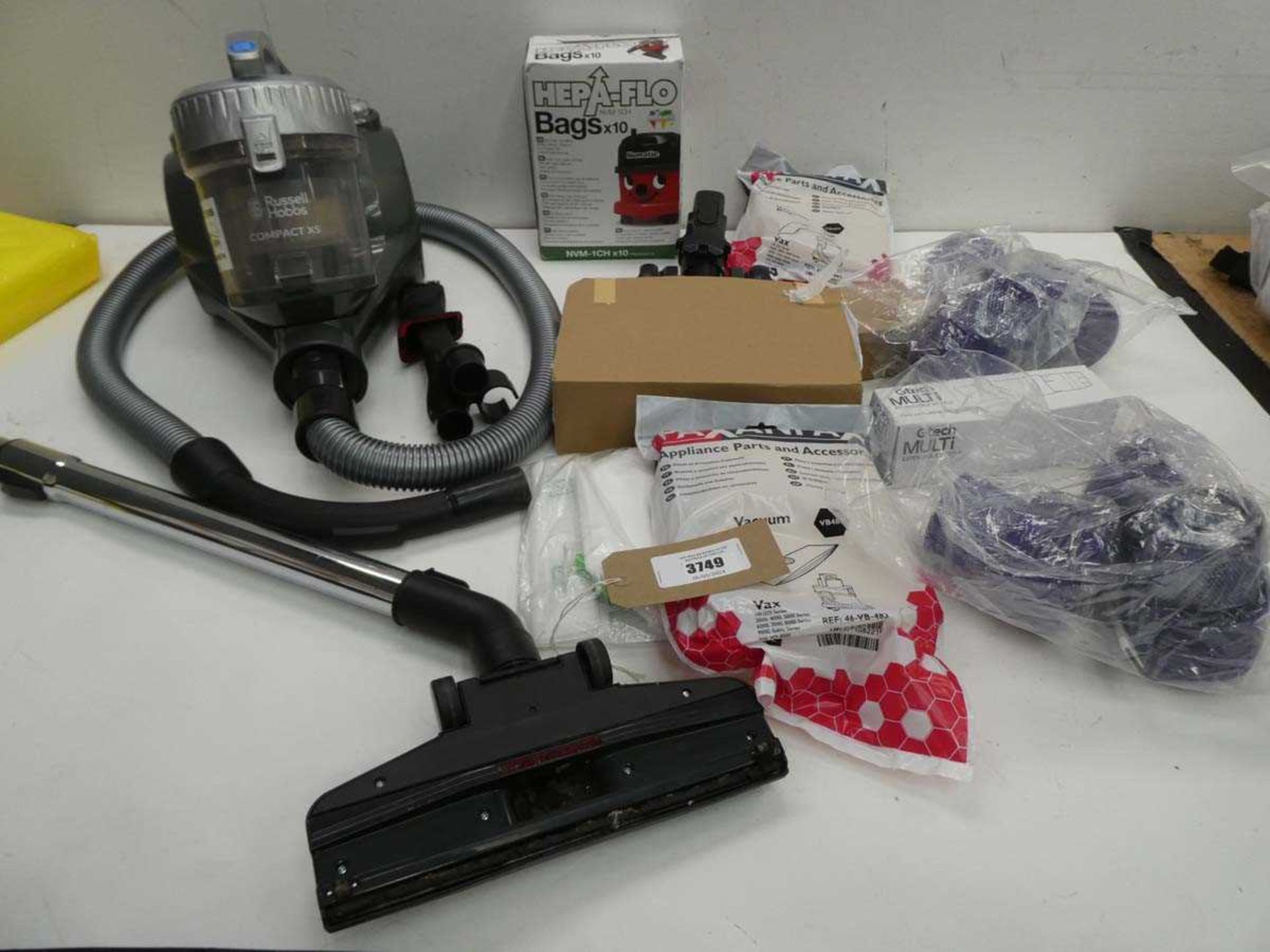 +VAT Shark vacuum head, Russell Hobbs Compaxt X5 vacuum cleaner, filters, dust bags etc