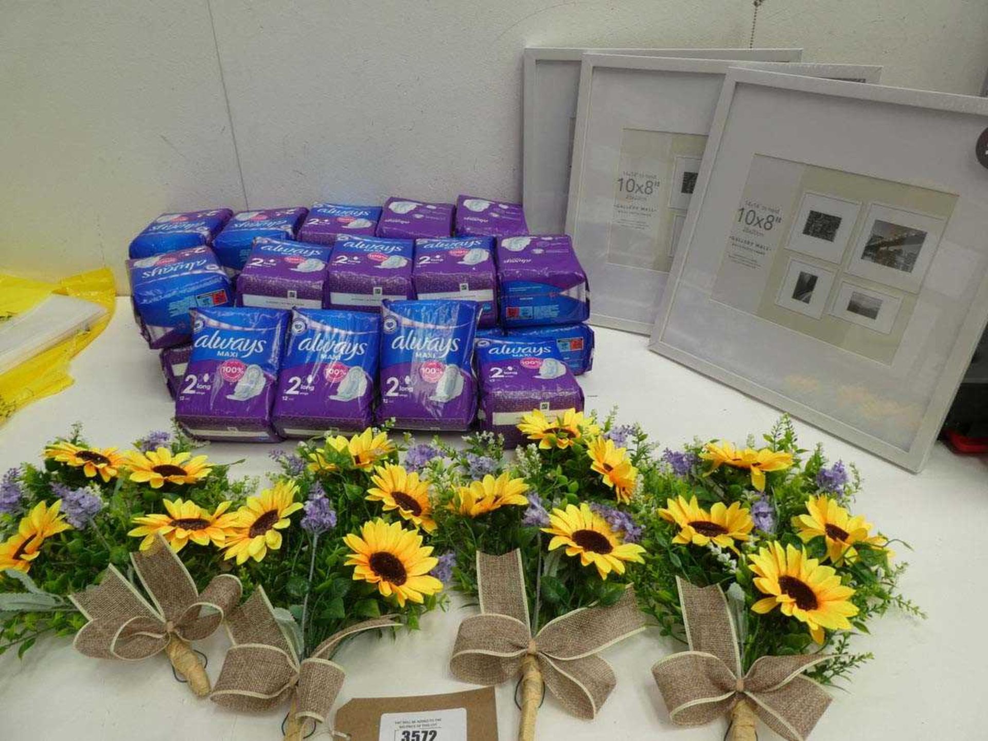 +VAT 24 packs of Always Maxi pads, 4 artificial flower bouquets and 3 10"x 8" picture frames