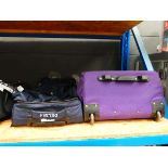 +VAT Roller duffle suitcase and a purple suitcase