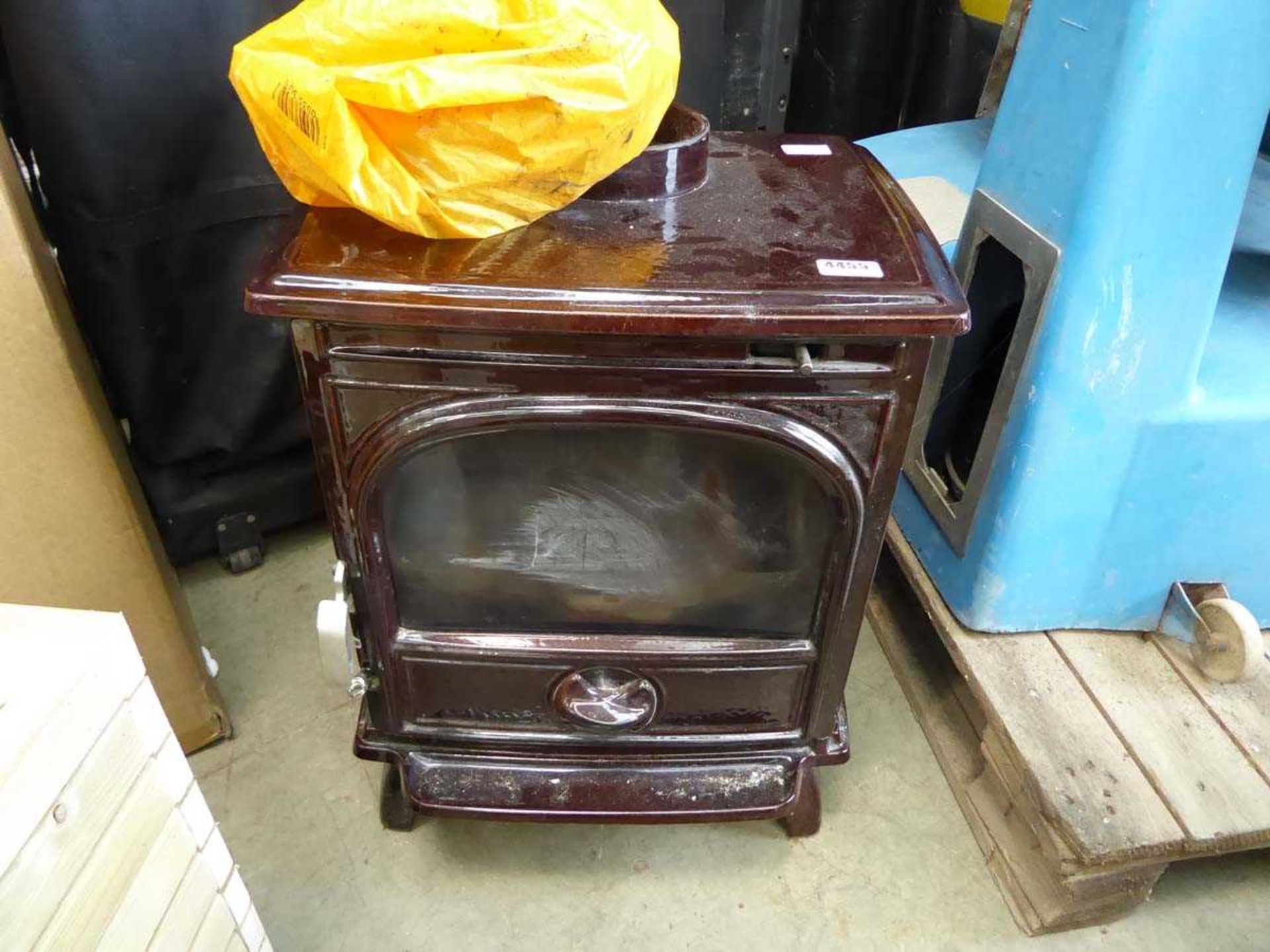 Large wood burning stove with 2 pieces of hearth and qty of flue pipe