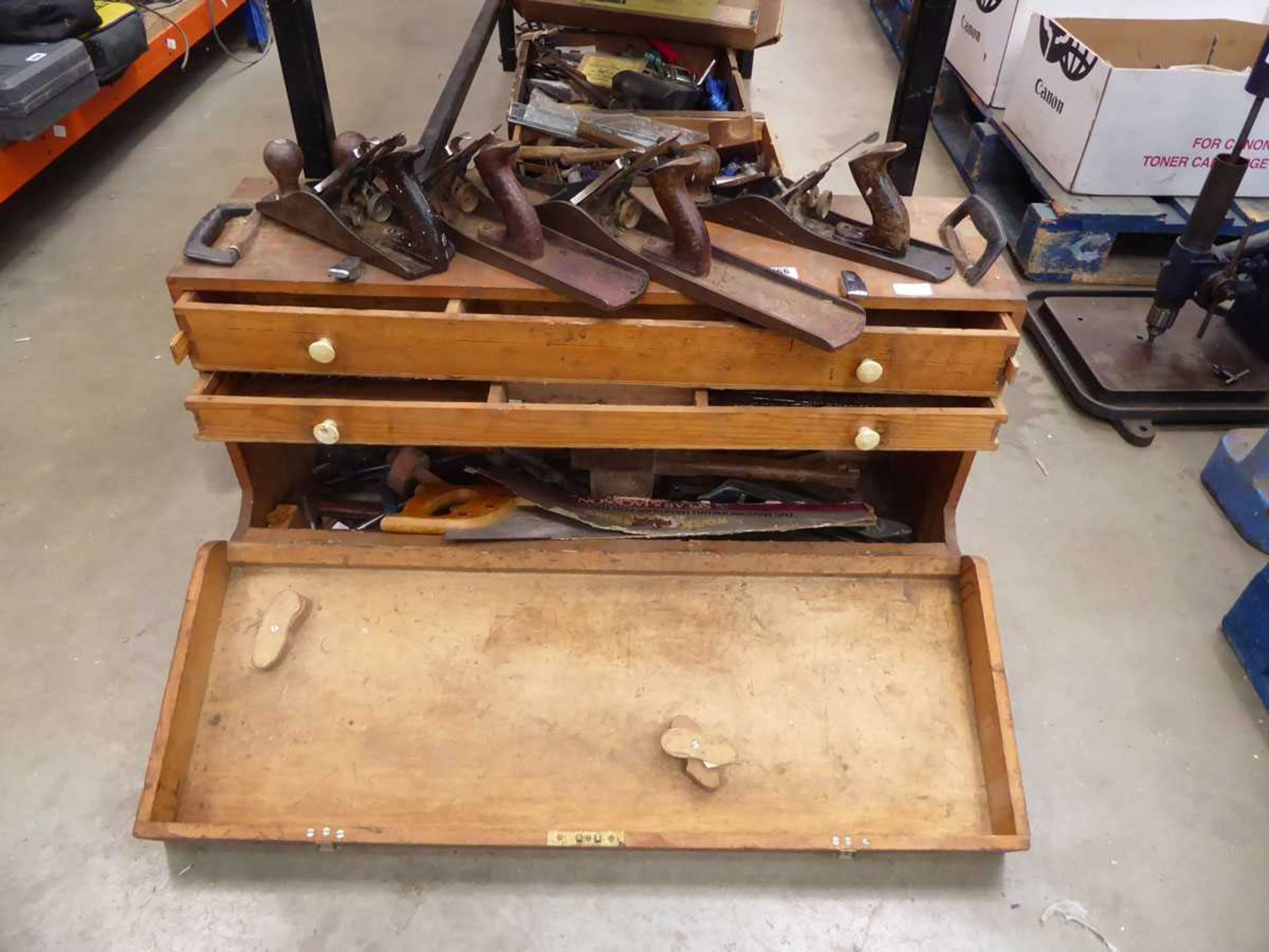 Carpenter's toolbox with a large quantity of assorted carpentry tools including planes, saws,