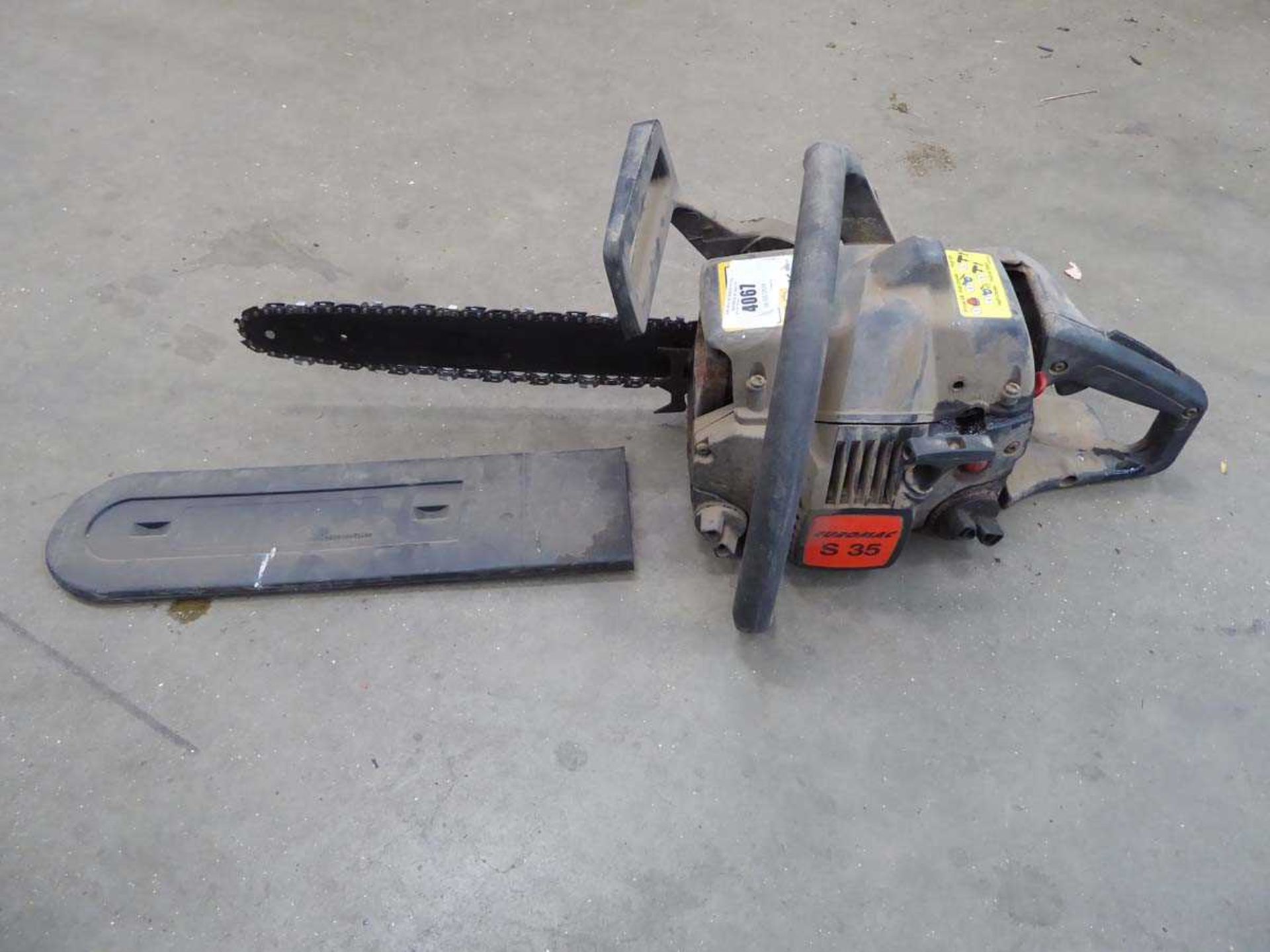 Black petrol powered chainsaw