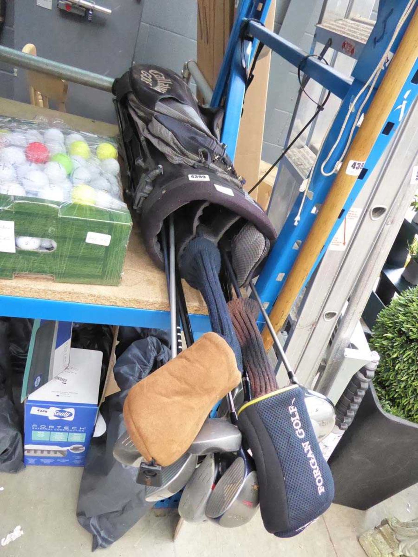 Golf bag with assorted clubs