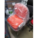 4 orange cloth stacking chairs