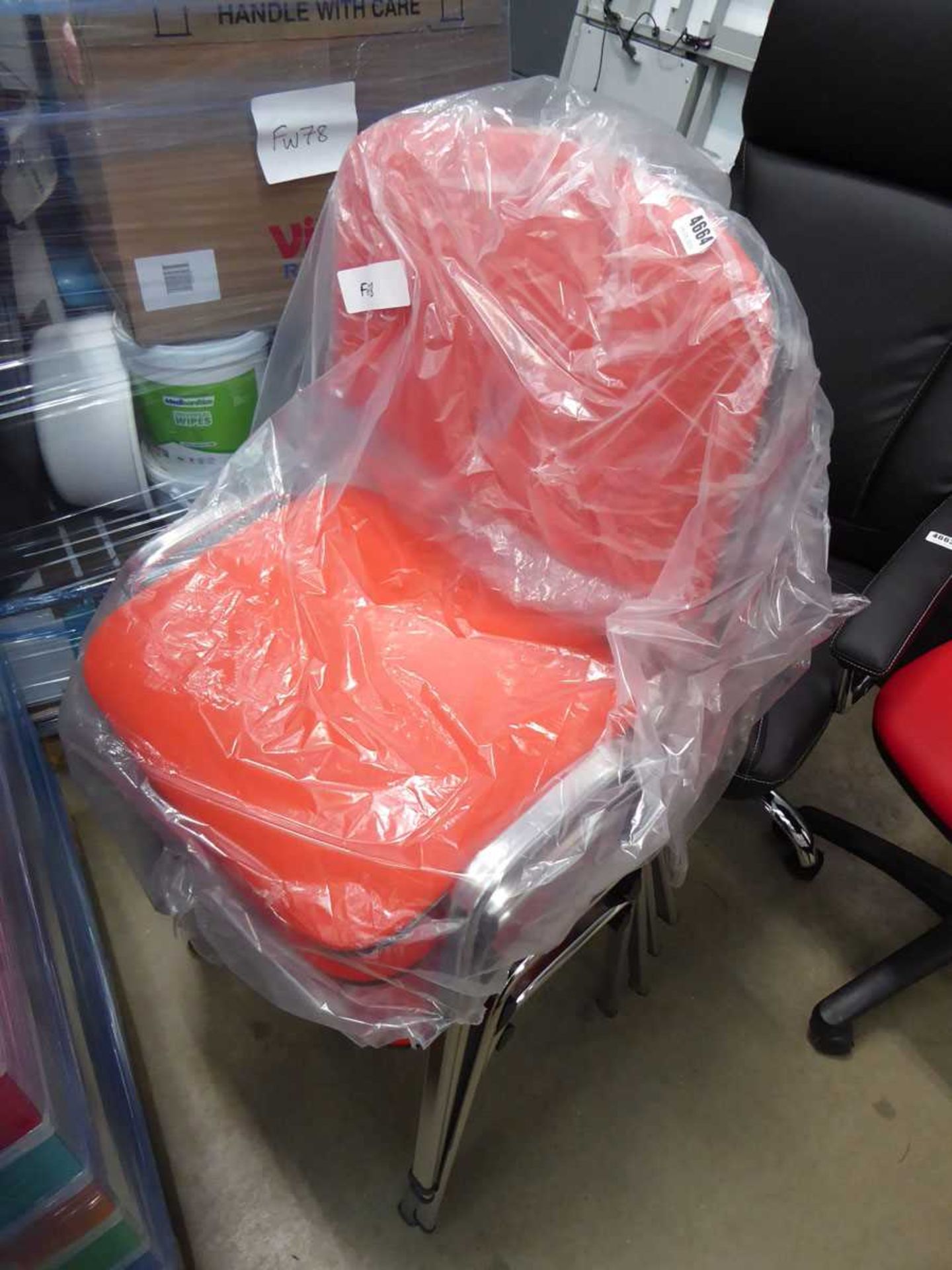 4 orange cloth stacking chairs