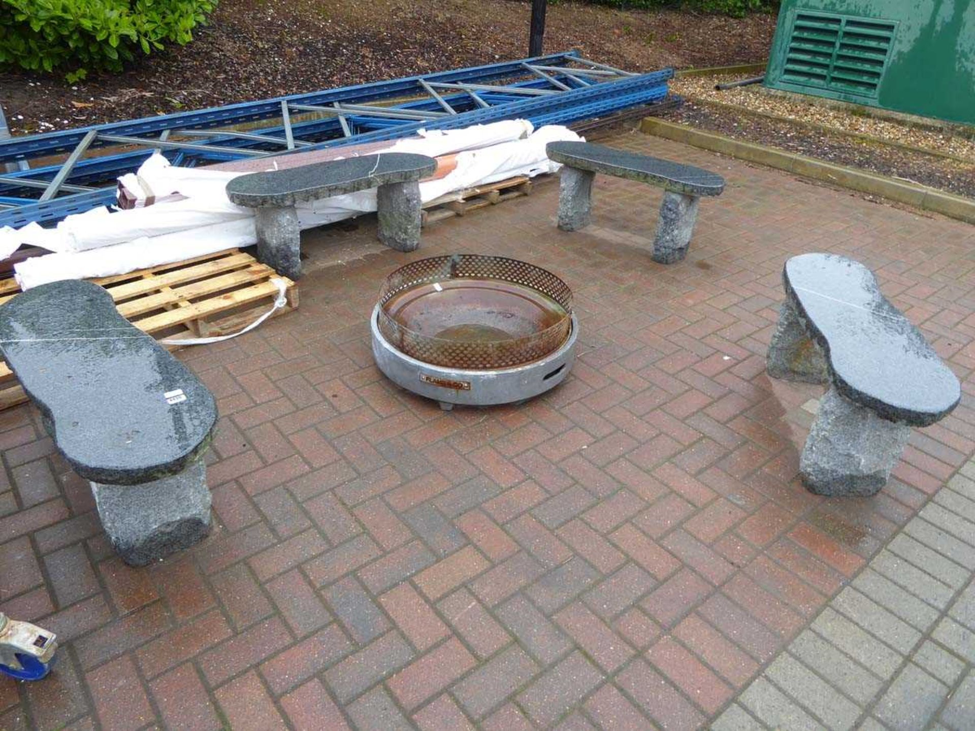 4 large granite style benches and a fire pit