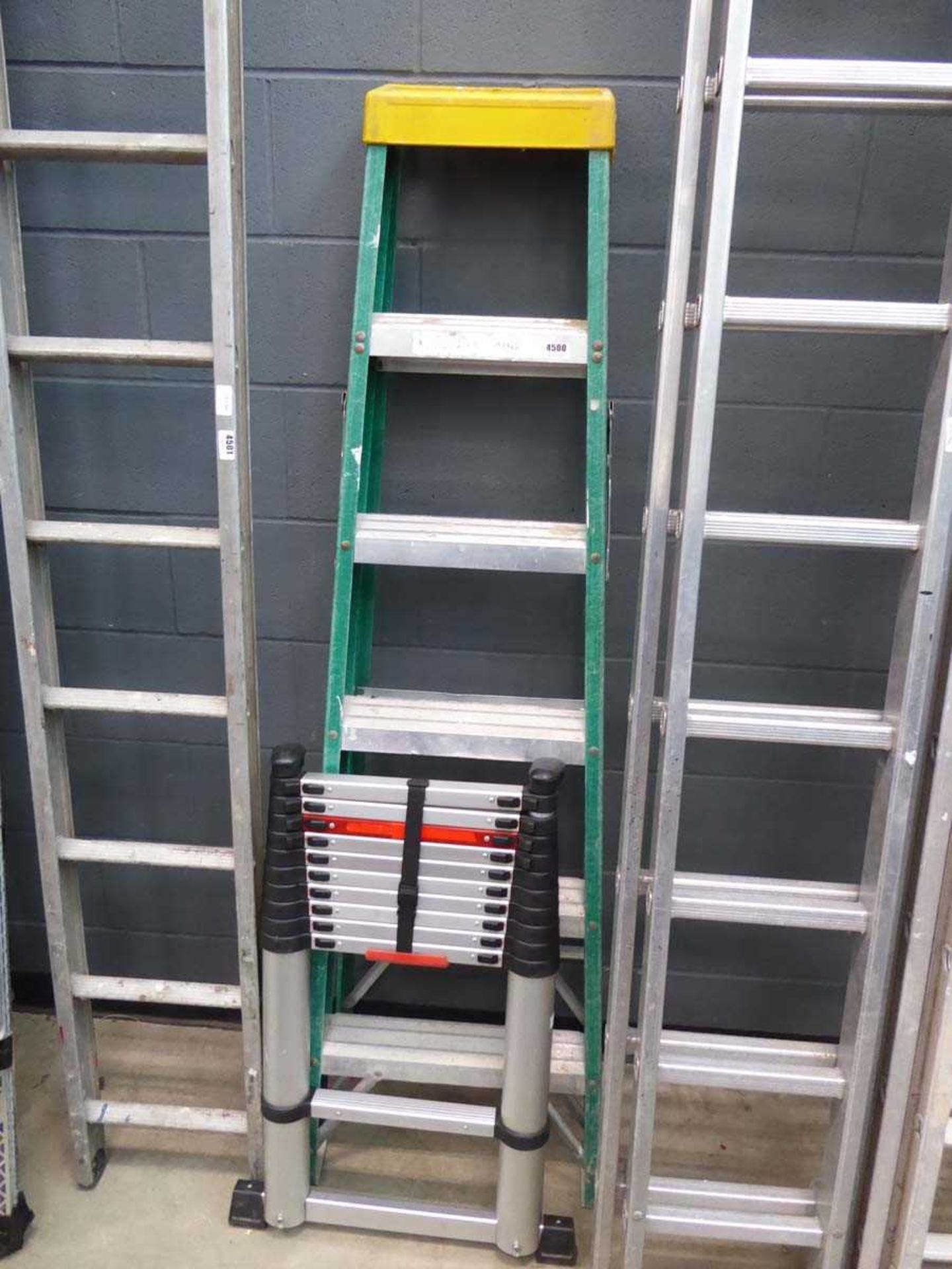 Telescopic ladder and 6 tread green and silver electricians style stepladder