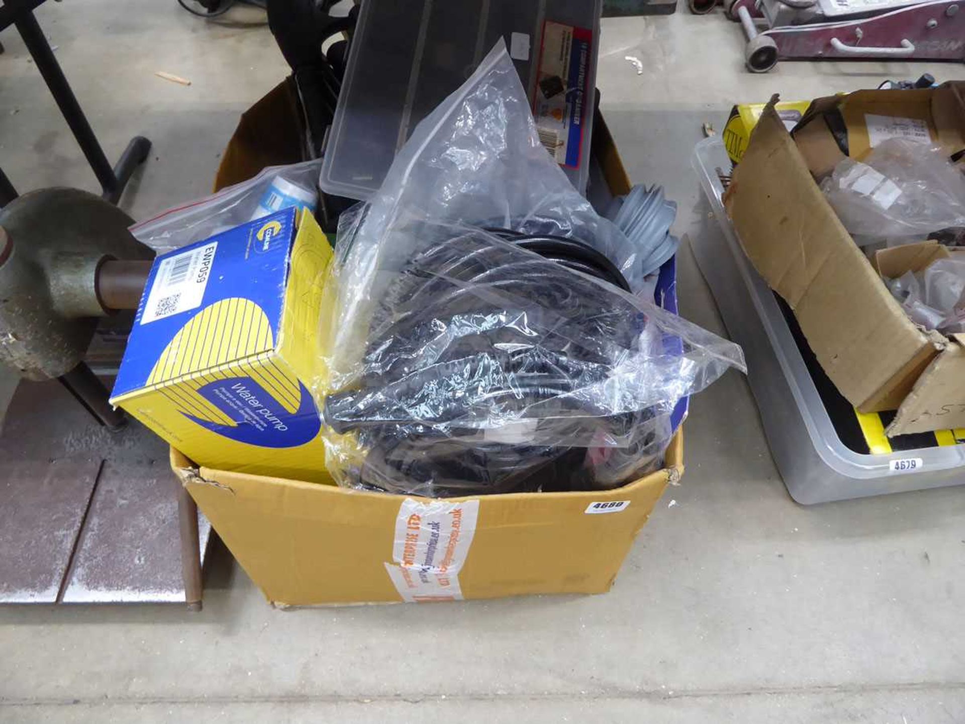 Box containing pressure washer hoses, washing machine pipes, fans etc.